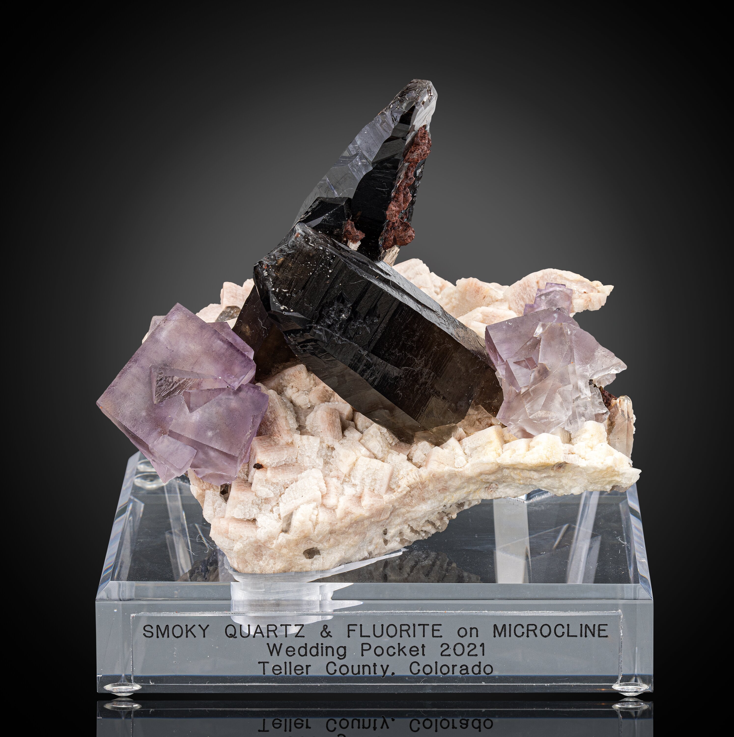 Twinned Fluorite and Smoky Quartz on Feldspar